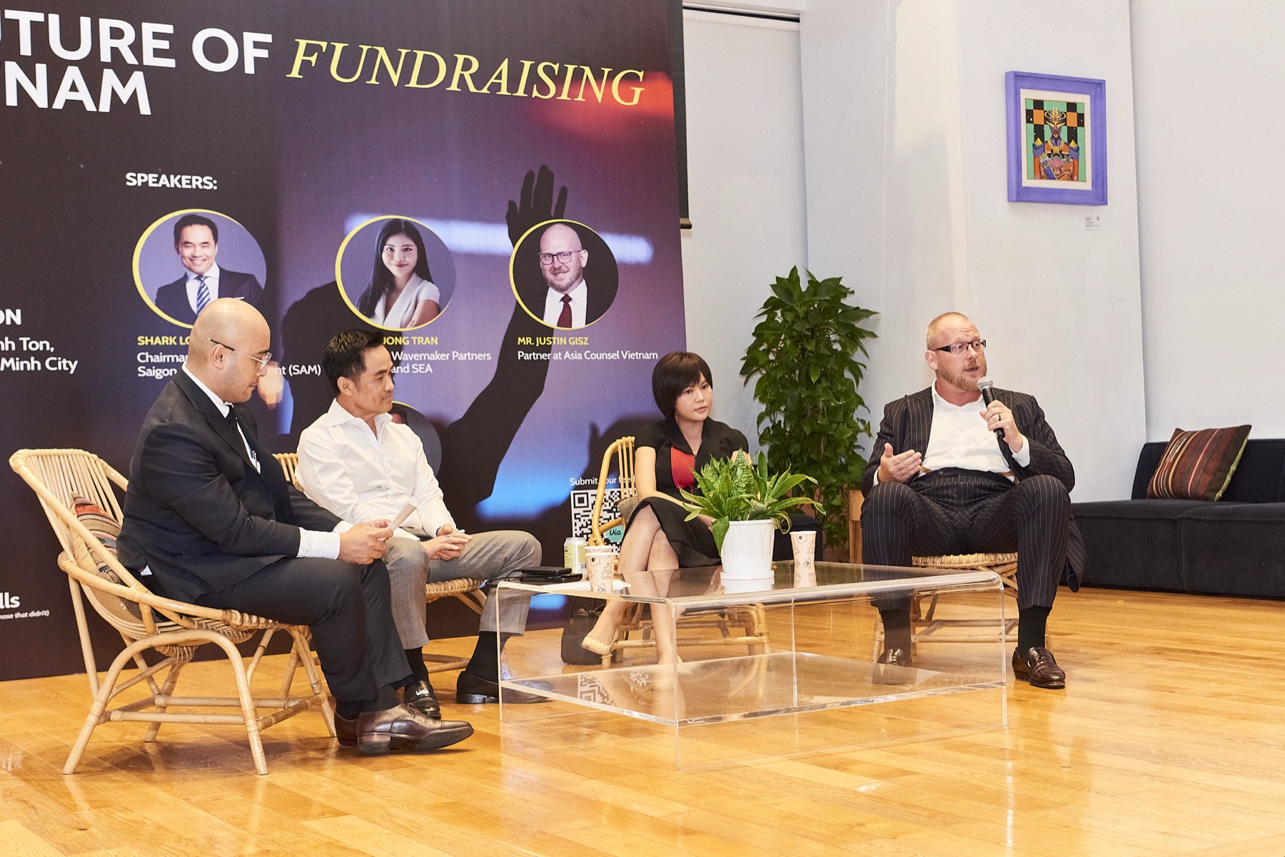 Panel speakers in conversation
