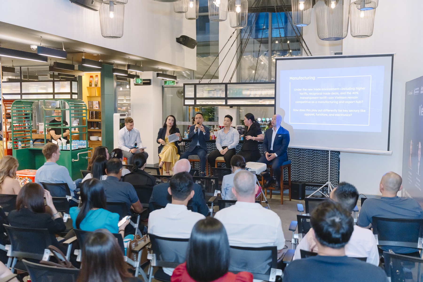 An audience listening to a panel discussion