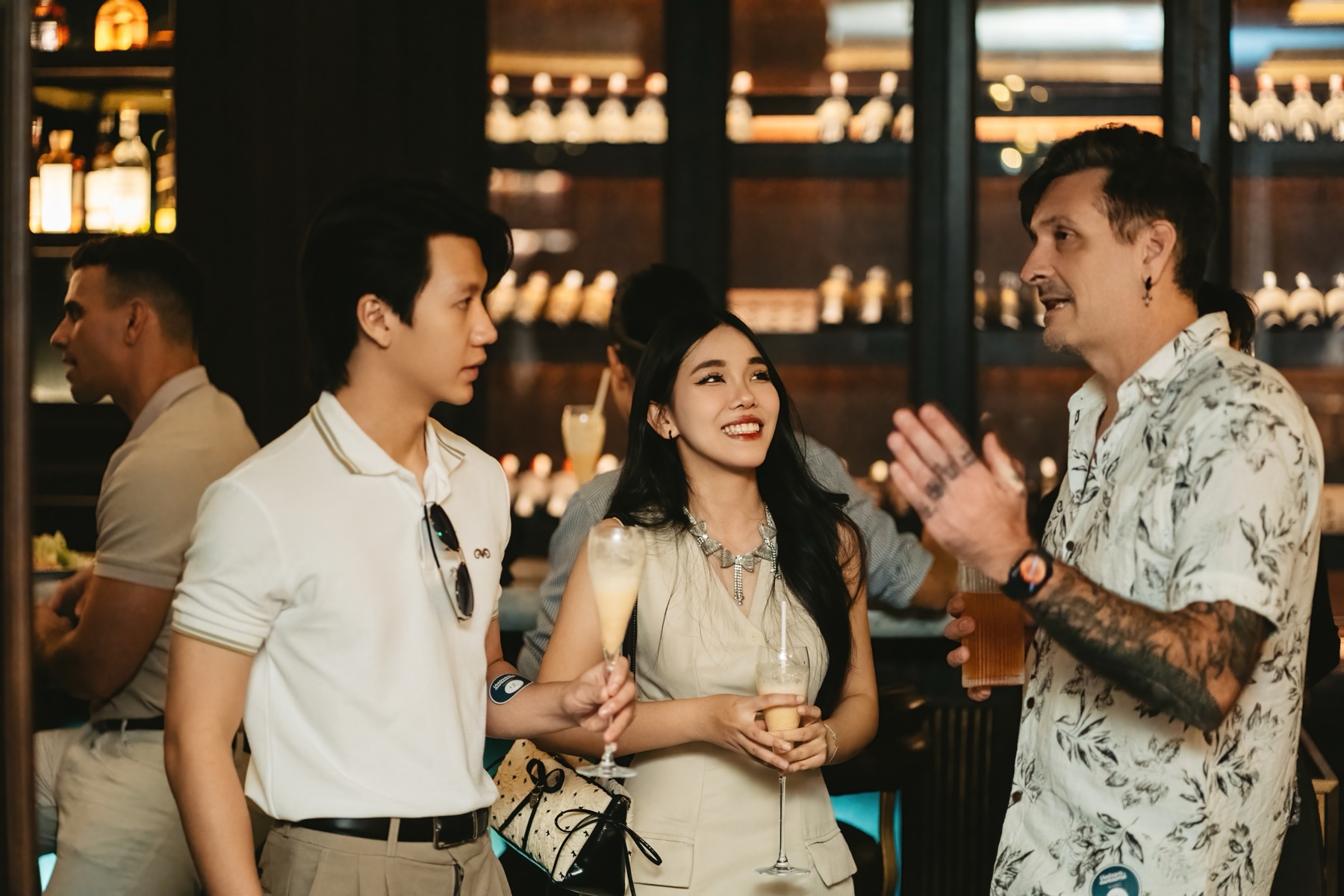 Members chatting over drinks at a networking mixer